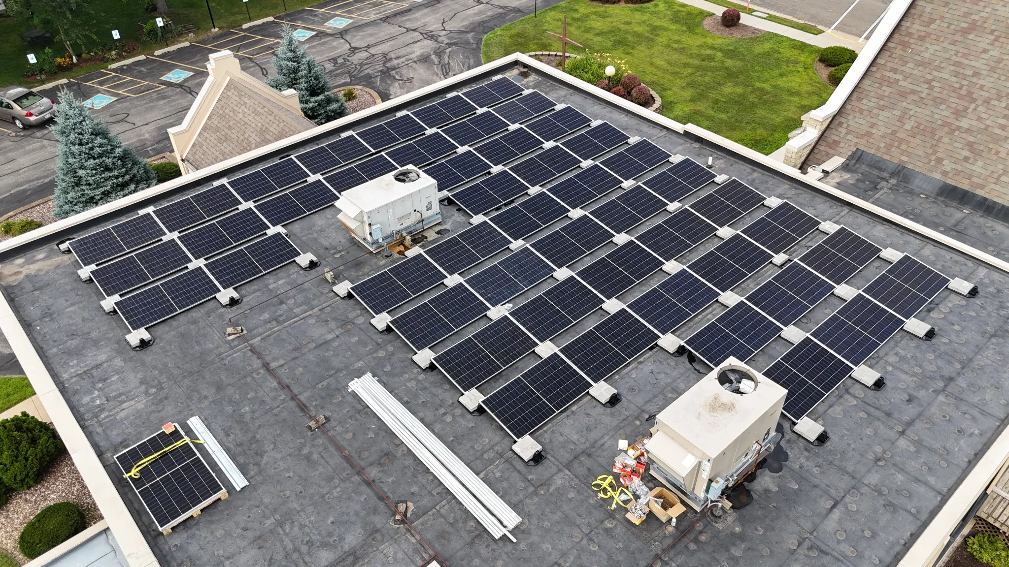 Commercial rooftop solar panels providing renewable energy for Trinity Lutheran Church