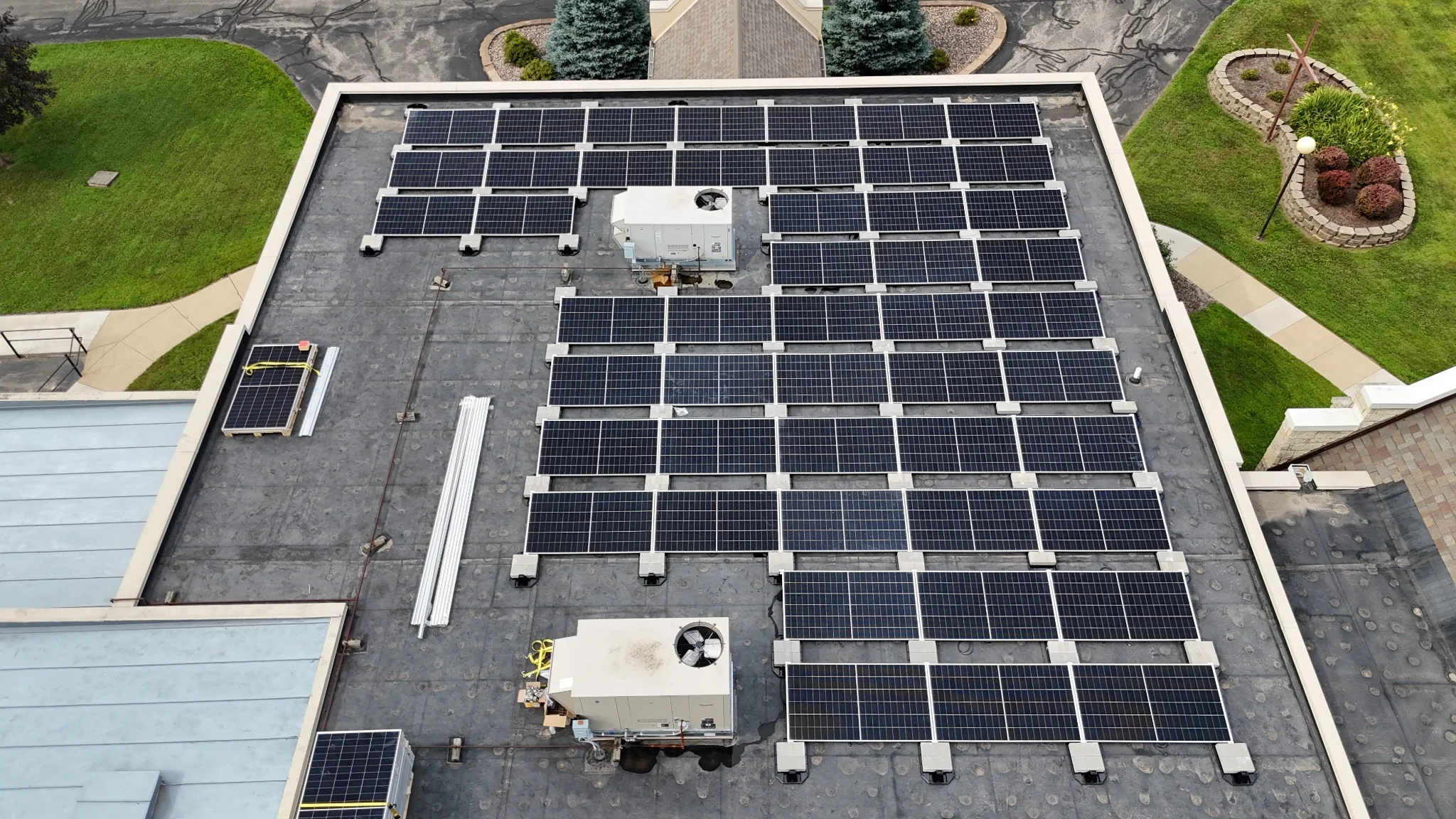 Ballasted solar panel installation on the flat roof of Trinity Lutheran Church