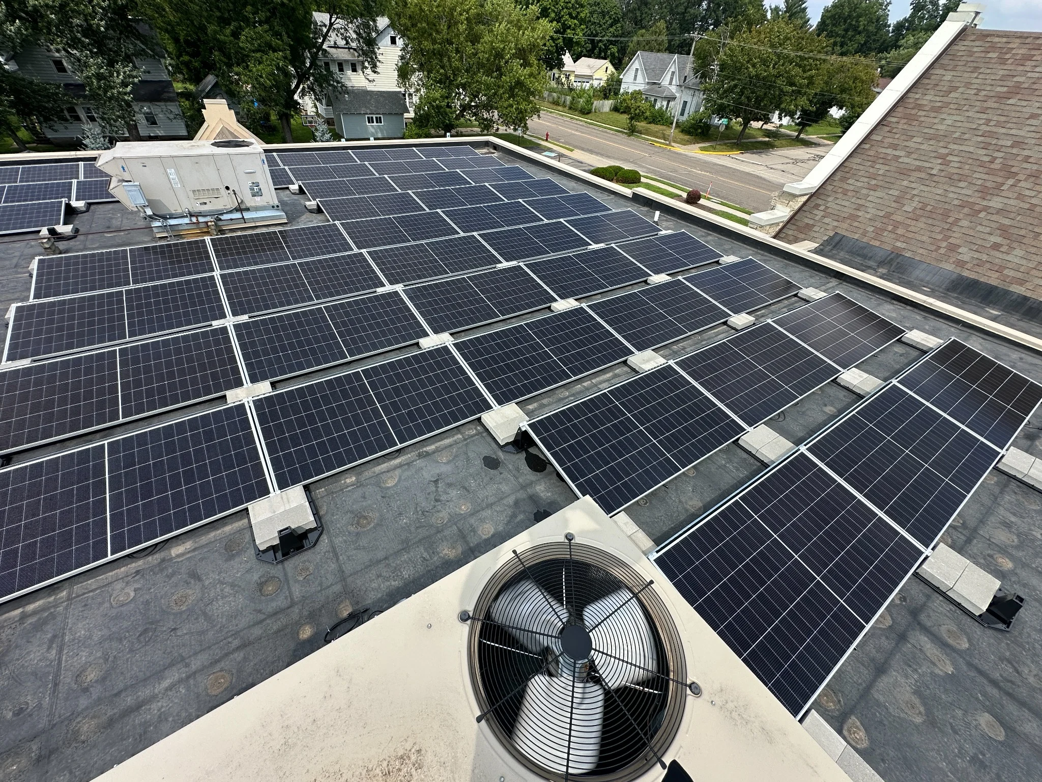 Close-up of commercial rooftop solar panels at Trinity Lutheran Church