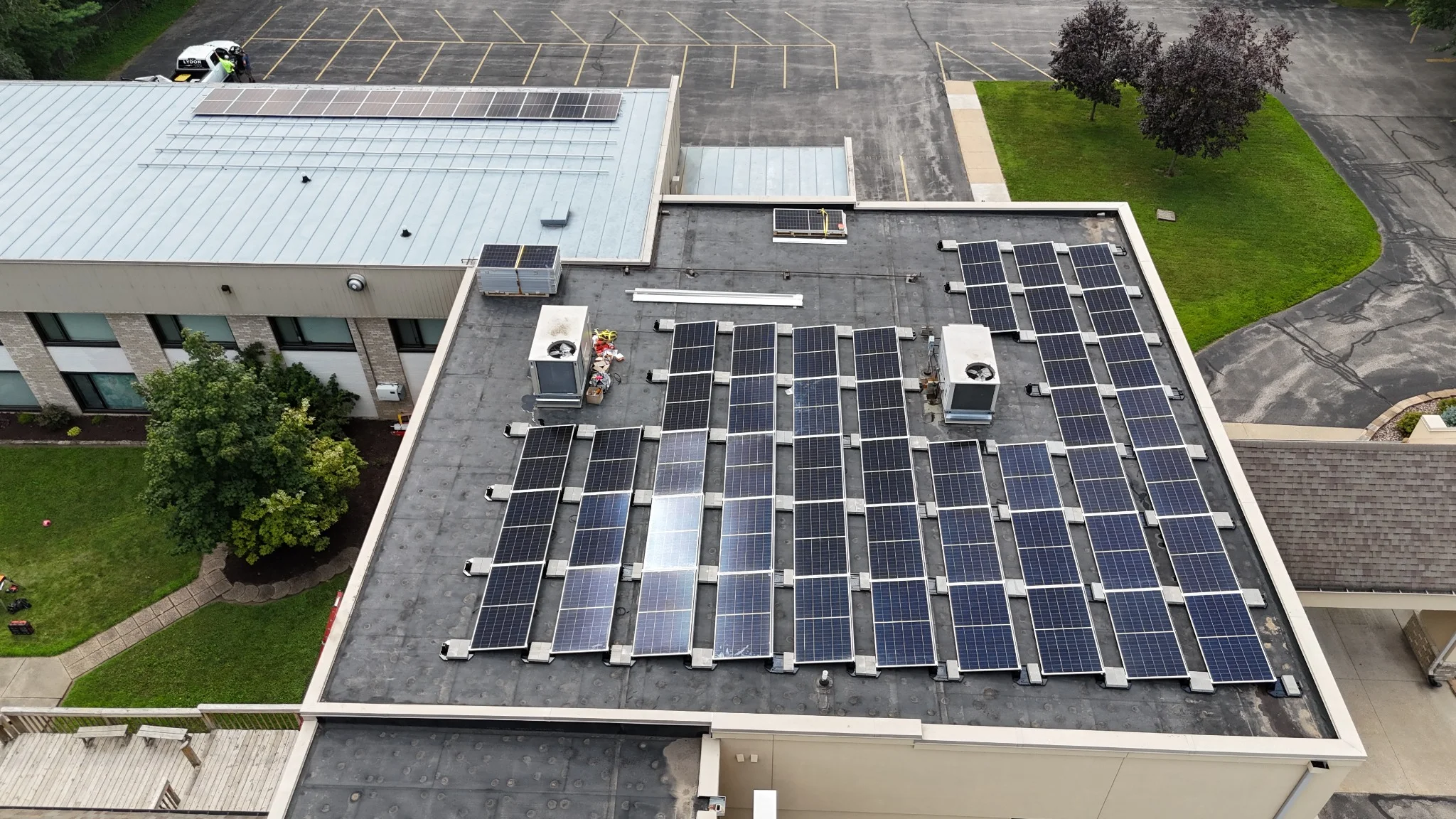 Close aerial view of commercial solar panel arrays at Trinity Lutheran Church